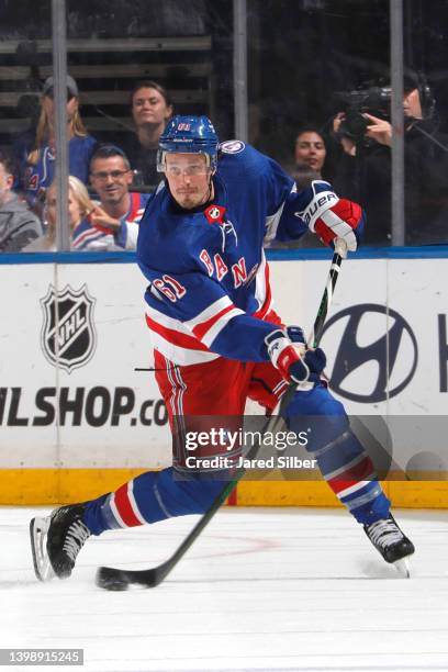 Justin Braun of the New York Rangers skates with the puck against the Carolina Hurricanes in Game Three of the Second Round of the 2022 Stanley Cup...