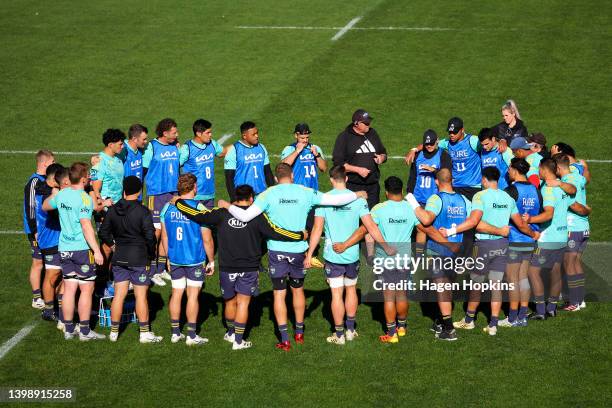 Players form a huddle during a Hurricanes Super Rugby Pacific training session at Rugby League Park on May 24, 2022 in Wellington, New Zealand.