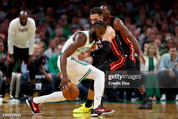Jaylen Brown of the Boston Celtics drives the ball against Max Strus of the Miami Heat during the third quarter in Game Four of the 2022 NBA Playoffs...