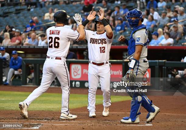 Pavin Smith of the Arizona Diamondbacks celebrates with Daulton Varsho after hitting a two run home run off of Zack Greinke of the Kansas City Royals...