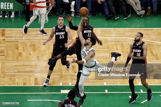 Jayson Tatum of the Boston Celtics shoots the ball against Bam Adebayo of the Miami Heat during the third quarter in Game Four of the 2022 NBA...