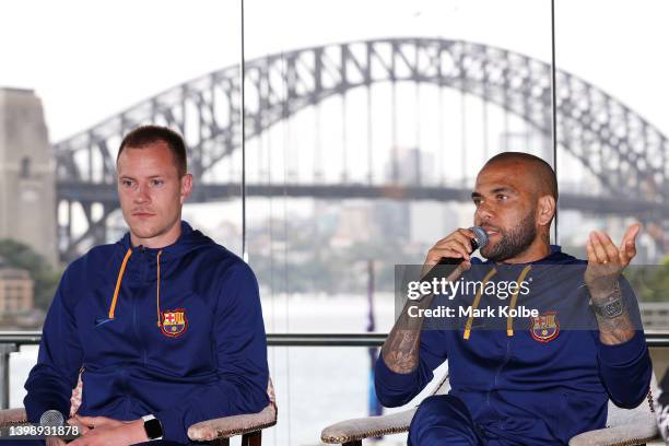 Marc-André ter Stegen of FC Barcelona looks on as Dani Alves of FC Barcelona speaks to the press during a media opportunity at Pullman Grand Quay...