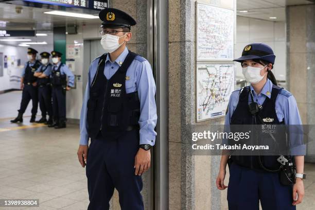 Police officers are seen at a subway station on May 24, 2022 in Tokyo, Japan. President Biden arrived in Japan after his visit to South Korea, part...