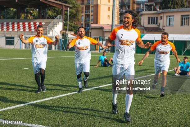 soccer team celebrates a match success - soccer goal stock pictures, royalty-free photos & images