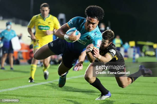 Tomasi Alosio of Moana Pasifika scores a try during the round 10 Super Rugby Pacific match between the Moana Pasifika and the Western Force at Mt...