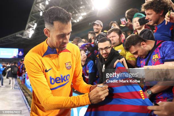 Sergio Busquets signs autographs for the crowd after an FC Barcelona training session at Accor Stadium on May 24, 2022 in Sydney, Australia.