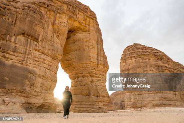 bearded young saudi man at elephant rock in al-ula - tor stock pictures, royalty-free photos & images