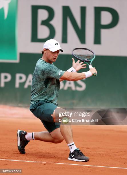 Ricardas Berankis of Lithuania plays a backhand against Laslo Djere of Serbia during the Men's Singles First Round match on Day 3 of the French Open...