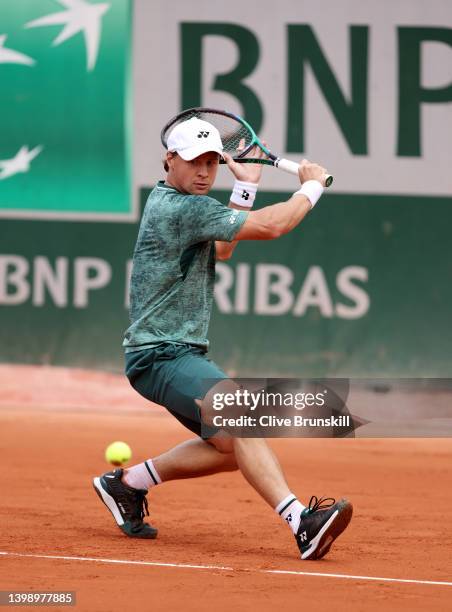 Ricardas Berankis of Lithuania plays a backhand against Laslo Djere of Serbia during the Men's Singles First Round match on Day 3 of the French Open...