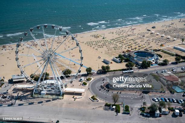 Aerial view, from a helicopter, the Ferris wheel on the beach on September 11, 2019 in Rimini, Italy. Italy's nearly 8000 km coastlines and islands...