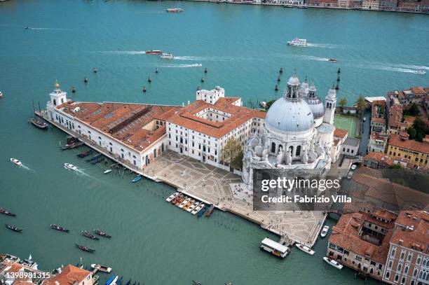 Aerial view, from a helicopter, of Punta della Dogana or Punta della Salute is an area of Venice, a thin triangular point dividing the Grand Canal...