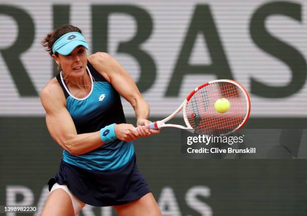 Alize Cornet of France plays a backhand against Misaki Doi of Japan during the Women's Singles First Round match on Day 3 of the French Open at...