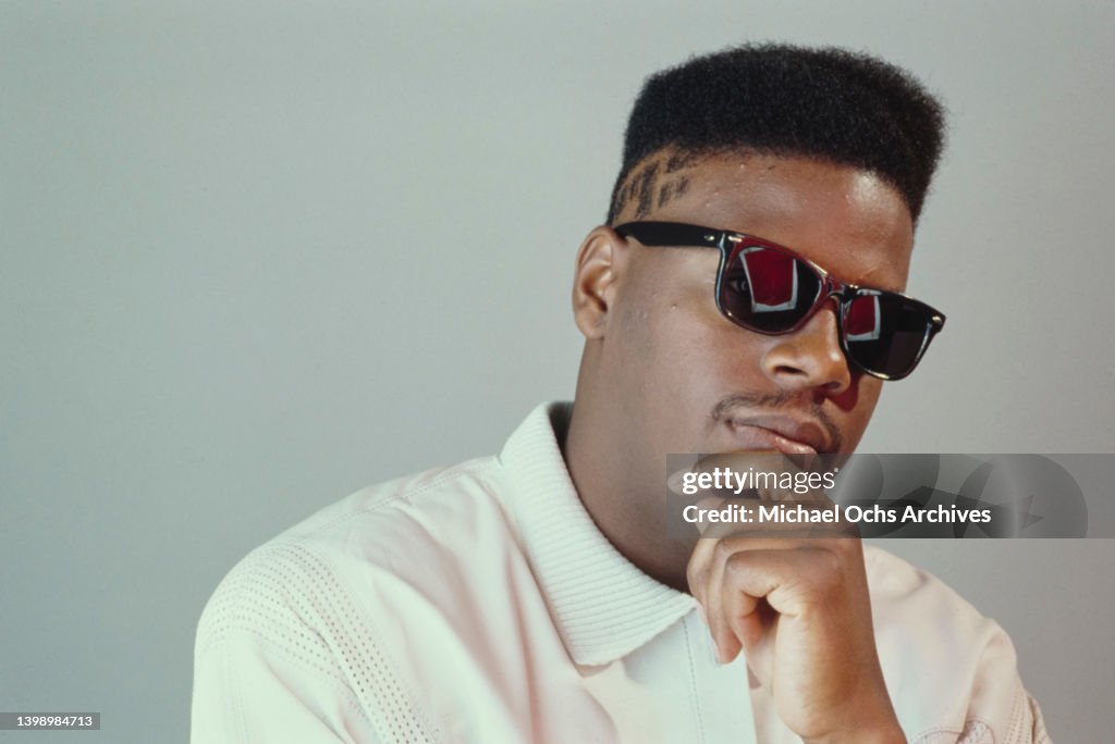 Scooly Rapper American rapper Schoolly D , a design shaved into his hair, wearing ...