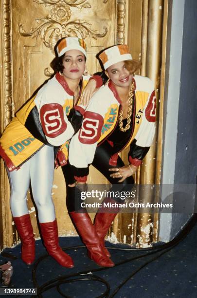 American hip hop band Salt-n-Pepa , both wearing kente kufi hats, leather baseball jackets, spandex leggings and thick gold chains, United States,...