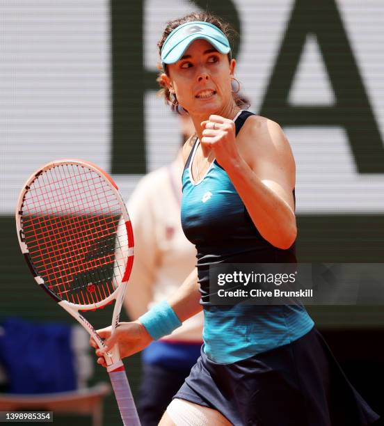 Alize Cornet of France celebrates a point against Misaki Doi of Japan during the Women's Singles First Round match on Day 3 of the French Open at...