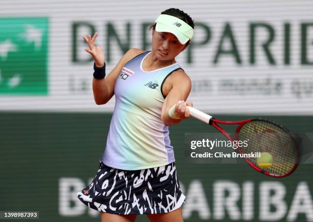 Misaki Doi of Japan plays a forehand against Alize Cornet of France during the Women's Singles First Round match on Day 3 of the French Open at...