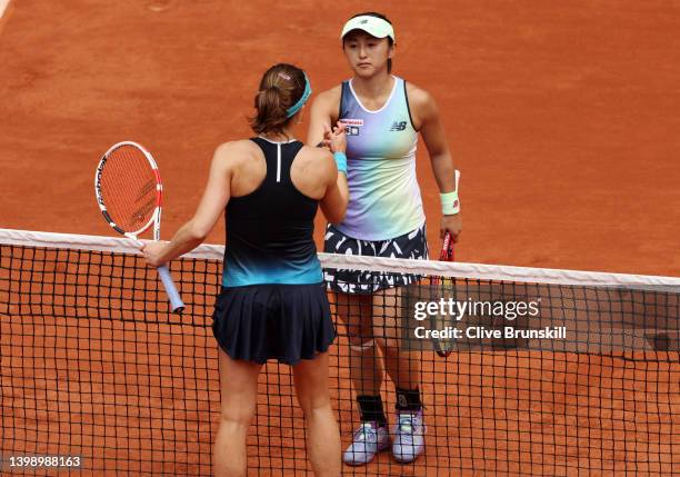 Misaki Doi of Japan interacts with Alize Cornet of France after the Women's Singles First Round match on Day 3 of the French Open at Roland Garros on...