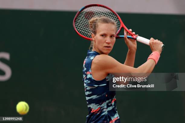 Viktorija Golubic of Switzerland plays a backhand against Katie Volynets of The United States during the Women's Singles First Round match on Day 3...