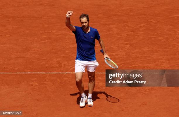 Richard Gasquet of France celebrates after winning match point against Lloyd Harris of South Africa during the Men's Singles First Round match on Day...