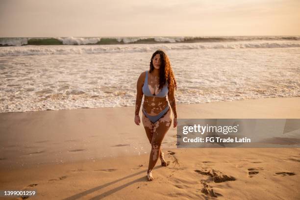 portrait of a woman in the beach - chubby swimsuit stock pictures, royalty-free photos & images