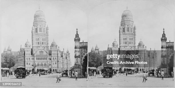 Stereoscopic image depicting pedestrians and traffic on the street before the Municipal Corporation Building in Bombay , India, circa 1895....