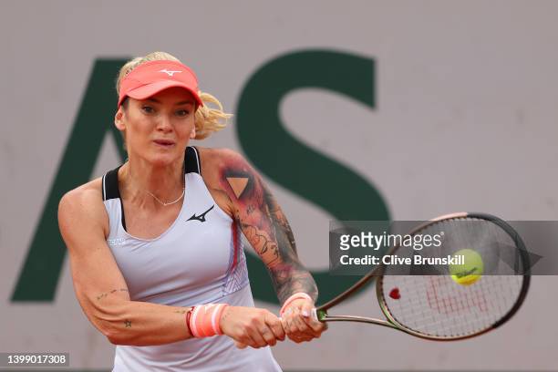 Tereza Martincova of Czech Republic plays a backhand against Shelby Rogers of The United States during the Women's Singles First Round match on Day 3...