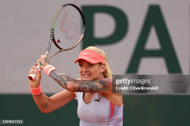 Tereza Martincova of Czech Republic plays a backhand against Shelby Rogers of The United States during the Women's Singles First Round match on Day 3...