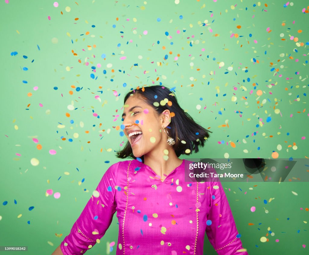 Woman celebrating with confetti