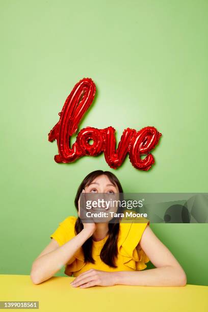 woman and the word love - next single word stock-fotos und bilder