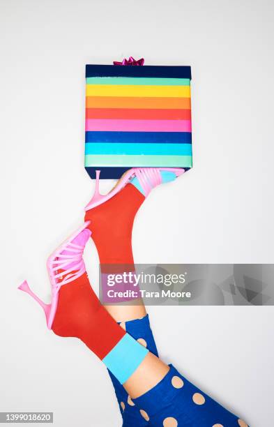 colourful high heels balancing present - polka dot fashion stock pictures, royalty-free photos & images