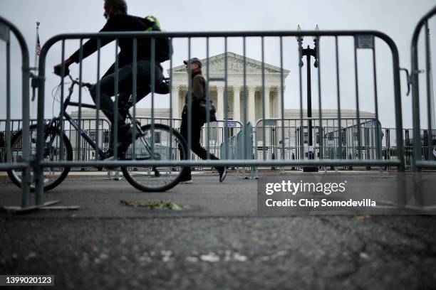 Protective fencing remains up around the U.S. Supreme Court building in anticipation of protest related to a possible decision in the Dobbs v....