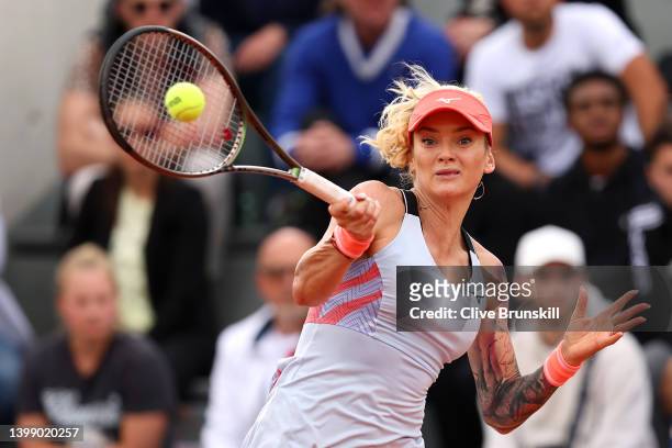 Tereza Martincova of Czech Republic plays a forehand against Shelby Rogers of The United States during the Women's Singles First Round match on Day 3...
