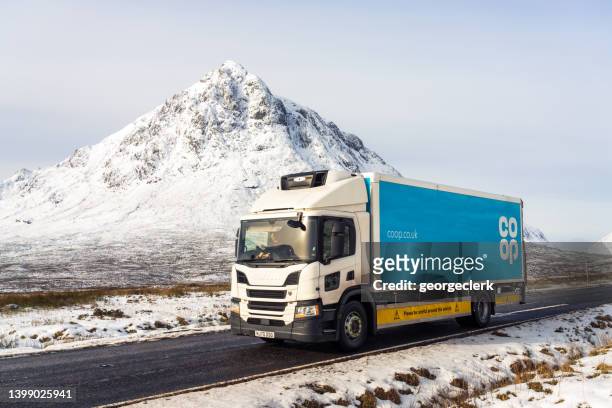 co-op lorry journey in scottish winter - travel logo stock pictures, royalty-free photos & images