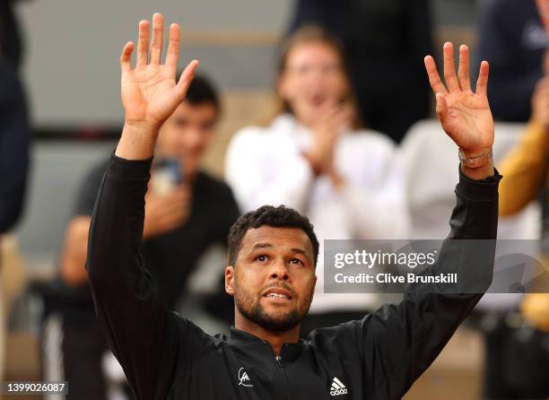 Jo-Wilfried Tsonga of France waves goodbye to the crowd after losing his match against Casper Ruud of Norway, his last match at Roland Garros during...
