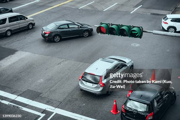 turning cars at the intersection with right arrow sign - taiwan icon stock pictures, royalty-free photos & images