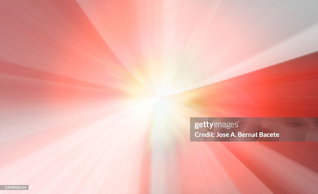 Explosion and flash of colored light on a pink background.