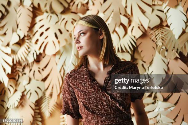 portrait of a young girl on a background with palm leaves. tropical background. portrait of a woman. - women pastel stock pictures, royalty-free photos & images