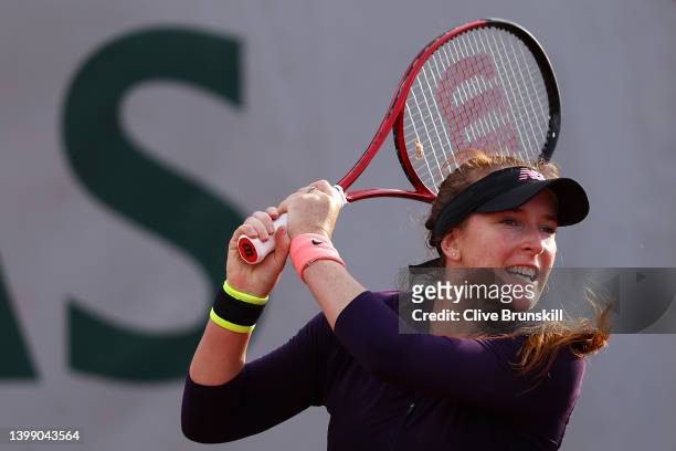 Madison Brengle of USA plays a backhand against Mihaela Buzarnescu of Romania during the Women's Singles First Round match on Day 3 of the French...