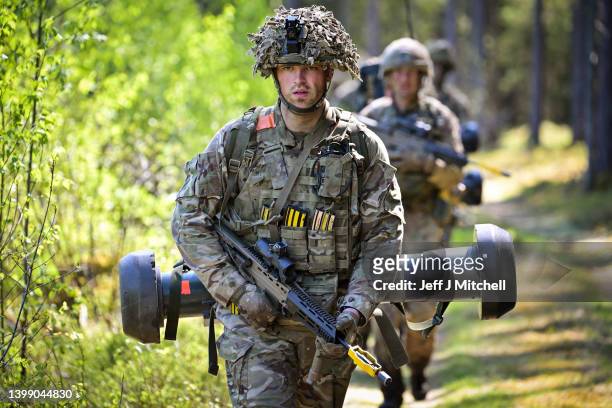 Soldiers from the Royal Welsh Battlegroup take part in maneuvers during NATO exercise operation Hedgehog on the Estonian Latvian border on May 24,...