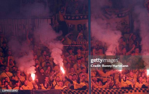 Fans light red flares during the Second Bundesliga Playoffs Leg Two match between Dynamo Dresden and 1. FC Kaiserslautern at Rudolf-Harbig-Stadion on...