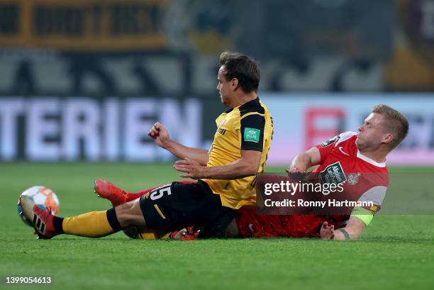 Chris Löwe of Dyamo Dresden challenges Jean Zimmer of 1. FC Kaiserslautern during the Second Bundesliga Playoffs Leg Two match between Dynamo Dresden...