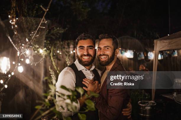 portrait of a romantic gay couple getting married - handsome native american men stock pictures, royalty-free photos & images