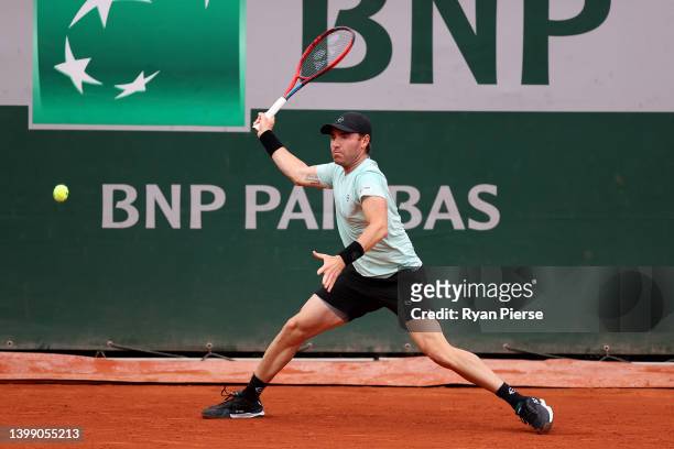 Bjorn Fratangelo of USA plays a forehand against Jannik Sinner of Italy during the Men's Singles First Round match on Day 3 of the French Open at...