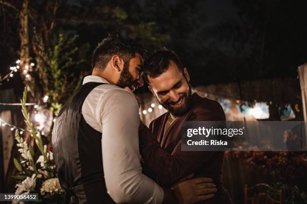 newlywed gay men having a first dance - wedding couple bildbanksfoton och bilder