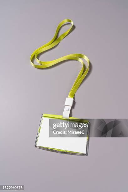 blank id badge with green lanyard - lanyard man stock-fotos und bilder