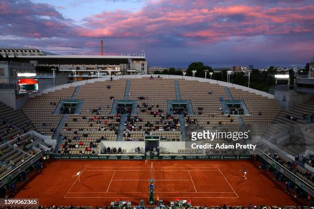 General view of sunset as Chloe Paquet of France plays against Aryna Sabalenka during the Women's Singles First Round match on Day 3 of the French...