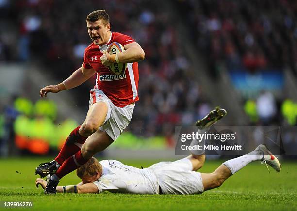 Scott Williams of Wales evades David Strettle of England during the RBS 6 Nations match between England and Wales at Twickenham Stadium on February...