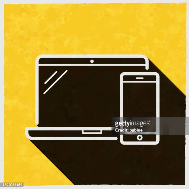 laptop und smartphone. symbol mit langem schatten auf strukturiertem gelbem hintergrund - desk organizer stock-grafiken, -clipart, -cartoons und -symbole