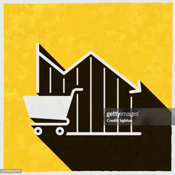 declining graph with shopping cart. icon with long shadow on textured yellow background - basket texture stock illustrations