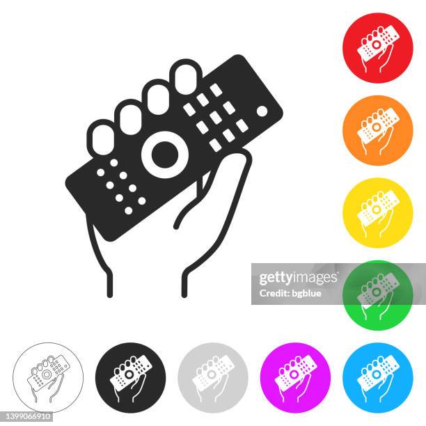 ilustraciones, imágenes clip art, dibujos animados e iconos de stock de mano sosteniendo el control remoto. icono en botones coloridos - sujetar en el aire